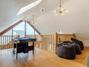 a room with a ping pong table in a house at 4 Bed in Portreath 77719 in Portreath