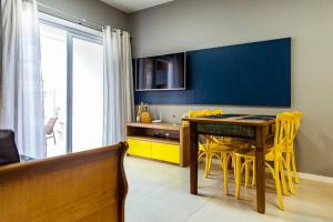 TV a/nebo společenská místnost v ubytování Praia e Piscina em Palmas do Arvoredo