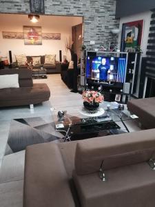 a living room with a couch and a tv at Andros Residence in Limassol