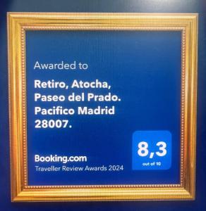 a picture of a sign in a gold frame at Retiro, Atocha, Paseo del Prado. Pacifico Madrid 28007. in Madrid