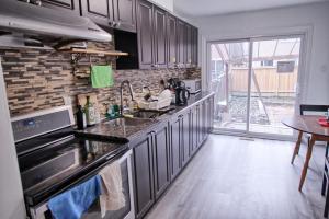 a kitchen with a sink and a counter top at Large and beautiful master room with private bathroom in Vaughan