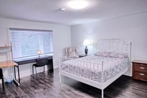 a bedroom with a bed and a desk and a keyboard at Large and beautiful master room with private bathroom in Vaughan