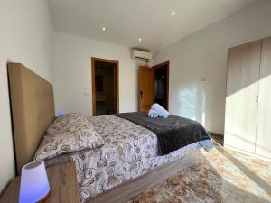 Ένα ή περισσότερα κρεβάτια σε δωμάτιο στο Amplio Apartamento, 5 camas
