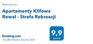 Apartamenty Klifowa Rewal - Strefa Rekreacji tesisinde sergilenen bir sertifika, ödül, işaret veya başka bir belge