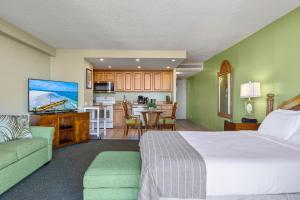 a hotel room with a bed and a kitchen at Kaanapali Shores 640 in Kahana