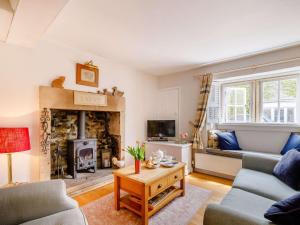 a living room with a couch and a fireplace at 1 bed property in Ashford in the Water PK903 in Ashford