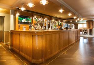 a bar in a pub with a wooden wall at Moffat Manor Holiday Resort in Beattock +15 photos
