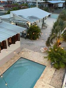 an overhead view of a house with a swimming pool at Peaceful Oasis near Combate Beach in Cabo Rojo