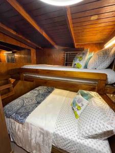 a room with two beds in a boat at Peaceful Oasis near Combate Beach in Cabo Rojo