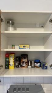 a kitchen pantry with shelves filled with food at Fewo Reutlingen Heinestrasse in Reutlingen