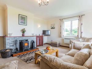 a living room with a couch and a fireplace at 2 Bed in Constantine TVEAN in Constantine