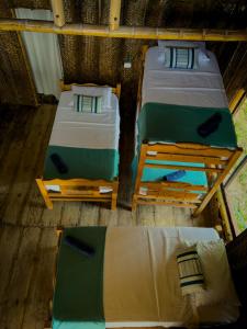 Katil atau katil-katil dalam bilik di Los Achiotes Hostal - Palomino