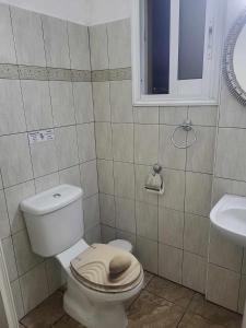 een badkamer met een toilet en een wastafel bij Elenas Home in Limassol