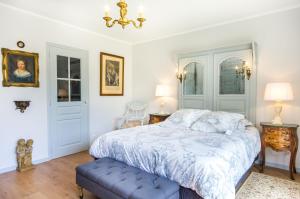 Posteľ alebo postele v izbe v ubytovaní L'Hôme du Monde