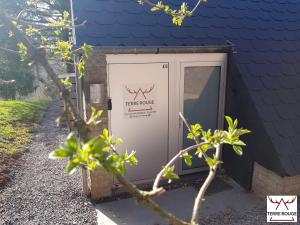a utility box sitting outside of a house at Terre Rouge - Terra Rubica - Les Terrasses de Malmedy in Malmedy