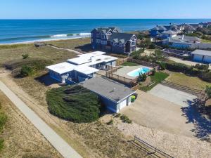 an aerial view of a house and the ocean at Clipper - Oceanfront Outer Banks Home with Private Pool - 5BR/3.5BA in Southern Shores
