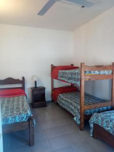 Postel nebo postele na pokoji v ubytování Departamentos Santiago