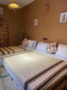 Ліжко або ліжка в номері Dar Nomads