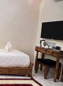 Postel nebo postele na pokoji v ubytování Riad Deluxe
