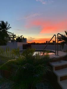 a view of a sunset from a resort with a playground at Casa zumar in Coveñas