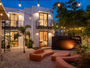 a large white house with lights on it at CASA FRIDA by DW in San Juan
