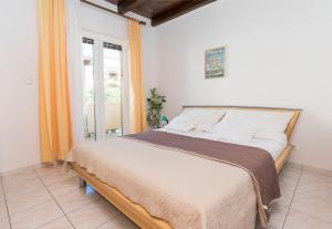 Posteľ alebo postele v izbe v ubytovaní Apartments Glorija
