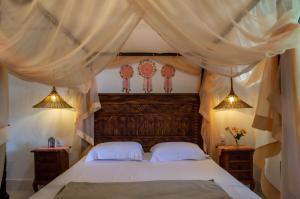 מיטה או מיטות בחדר ב-Suite NOAH - Guest House Guaiu