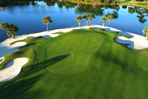 an aerial view of a golf course with a lake at Island Princess 707 Grouper Therapy in Fort Walton Beach