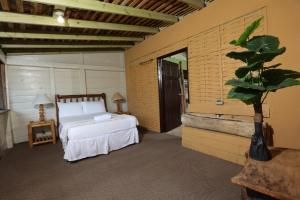 A bed or beds in a room at Strawberry Fields Together