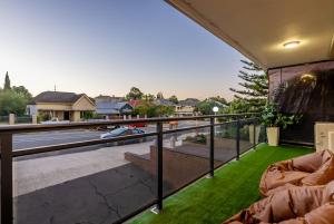 a balcony with a view of a house at EAST4 - Vintage Vibes East Freo 2B 1BA in Fremantle