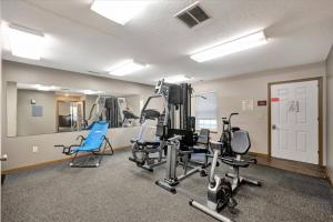a gym with several treadmills and exercise bikes at 2 bedroom apartment RivianISU in Bloomington