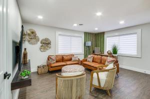a living room with leather couches and chairs at Stunning Jackson Home about 2 Mi to Downtown! in Jackson