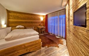TV a/nebo společenská místnost v ubytování Arosa Vetter Hotel