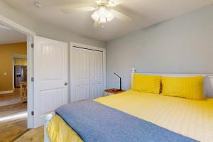 a bedroom with a bed and a ceiling fan at Marina's Edge in Myrtle Beach