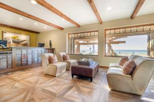 a living room with two chairs and a table at Best Western Plus Beach View Lodge in Carlsbad