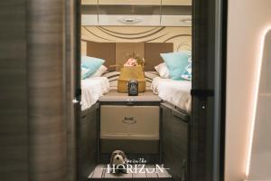 a room with two beds in a rv at Live On The Horizon 1 in Ribadesella
