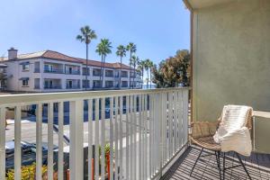 a balcony with a chair and a building at Best Western Plus Beach View Lodge in Carlsbad