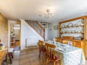 a dining room with a table and chairs at 2 Bed in Bourton-on-the-Water 29027 in Bourton on the Water