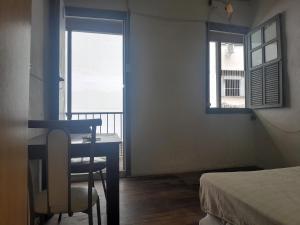 Postel nebo postele na pokoji v ubytování Cortiço da Lapa