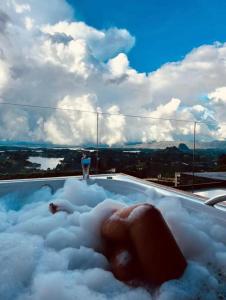 a jacuzzi tub with snow on top of it at Montecielo Hosting in Guatapé