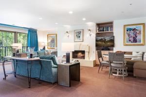 a living room with a couch and a fireplace at The Galatyn Lodge in Vail