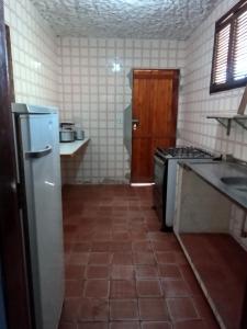 Kuchyňa alebo kuchynka v ubytovaní Casa Temporada Prainha - Aquiraz