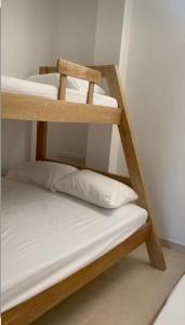 a couple of bunk beds in a room at Casa zumar in Coveñas
