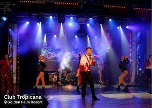 un grupo de personas bailando en un escenario en Villa Alto Prestige Holiday Home, en Chapel St. Leonards