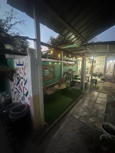 an outside view of a house with a patio at Maui's Place in Badian