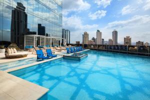 a swimming pool on the roof of a building at W Panama in Panama City