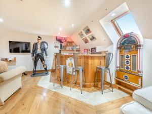 a living room with a statue of a man in a spider man costume at The Apartment - Uk45103 in Hoel-galed
