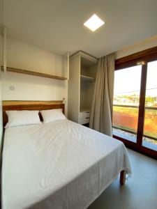 Giường trong phòng chung tại Villa Palmeira Flecheiras 202