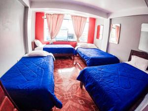 Un pat sau paturi într-o cameră la Hospedaje Piura