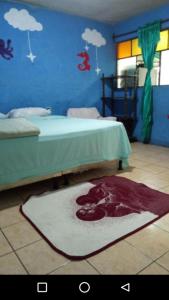 En eller flere senge i et værelse på Casa Ajachel